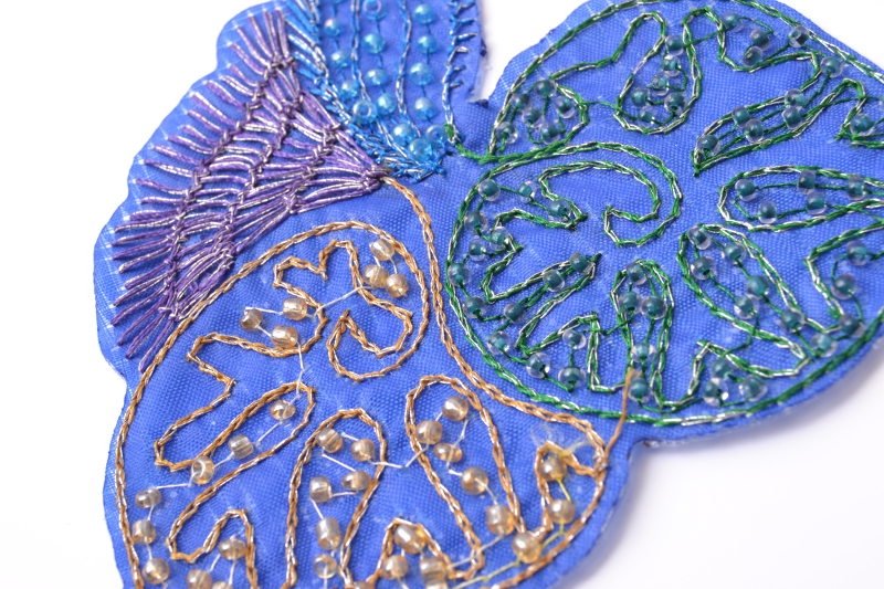 Blue flower design, thread and beads